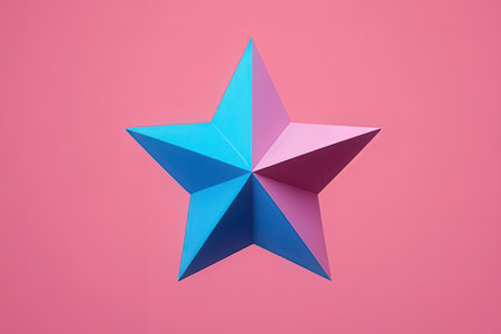 Origami star on a pink background. Minimalism concept.の写真素材
