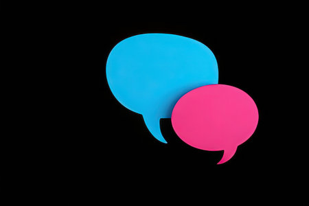 Two speech bubbles isolated on black background. Colorful speech bubbles.の写真素材