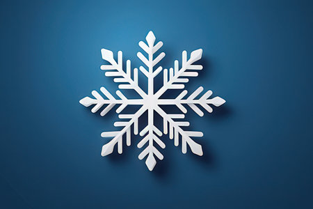 White paper snowflake on blue background. Christmas and New Year concept