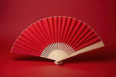 Red paper fan on a red background. 3d rendering, 3d illustration.の写真素材