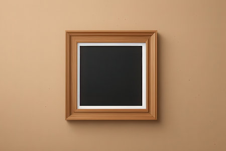 Wooden picture frame on a brown wall. View from above.の写真素材