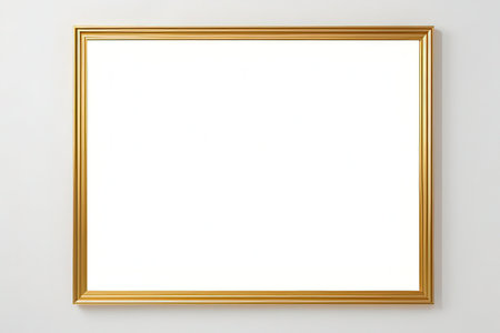 blank golden picture frame on white wall with copy space for text or imageの写真素材