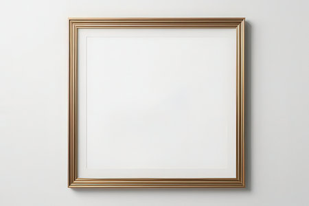blank picture frame on white wall with copy space for add text or imageの写真素材