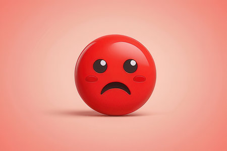 Red emoticon with sad face on red background. 3D renderingの写真素材