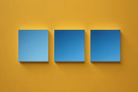 Three blue paper cards on a yellow wall. 3D rendering.の写真素材