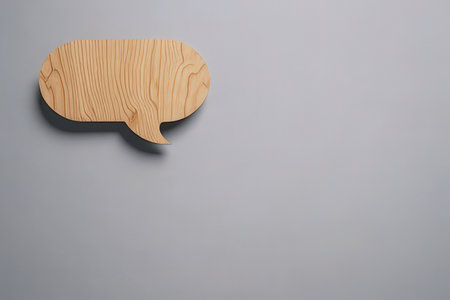 Wooden speech bubble on gray background. 3d render illustration.の写真素材