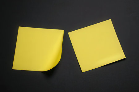 Yellow sticky notes on a black background. Copy space for your text.