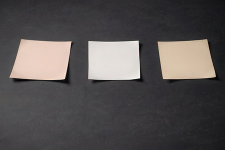 Blank paper sheets on black background. Mockup for branding identity.の写真素材