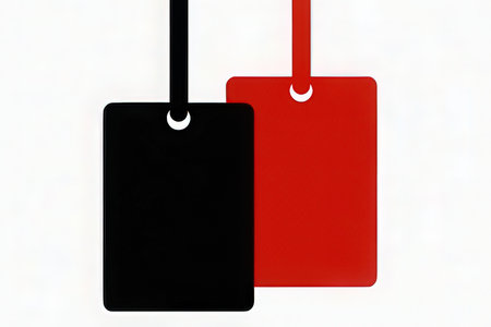 Red and black price tags on a white background with copy space.の写真素材
