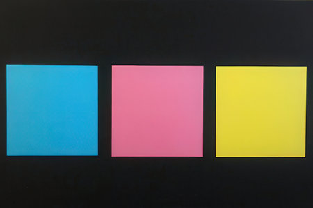 Colorful post it notes on blackboard background. Copy space.