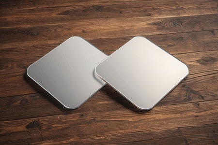 Blank metal plates on a wooden background. 3d rendering.の写真素材