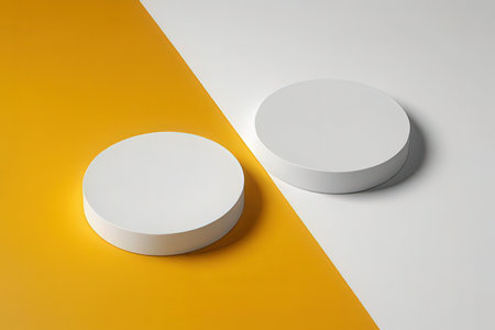 Two white round podiums on a yellow and white background. 3d renderの写真素材