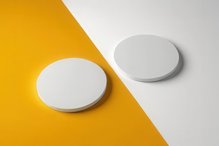 Two white round podiums on white and yellow background. 3d renderの写真素材