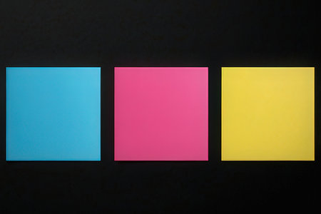 Colorful sticky notes isolated on black background. Copy space for text.の写真素材