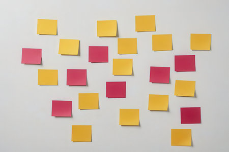 Colorful sticky notes on a white wall. The background is white.の写真素材