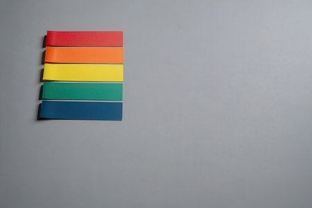 Colorful papers on a gray background.の写真素材