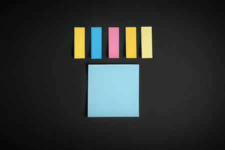 Colorful sticky notes isolated on black background, business and education conceptの写真素材
