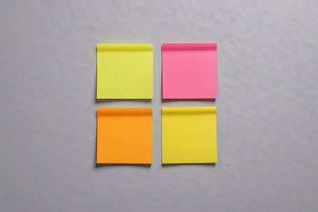 Sticky notes on a white wall background with copyspace.の写真素材