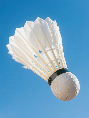 Shuttlecock against the blue sky in a badminton courtの写真素材