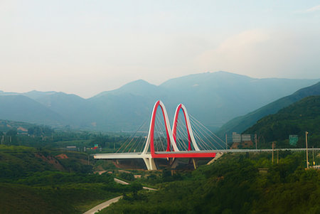 Bridge over the river in the mountains. View from the mountain.の写真素材