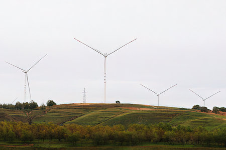 Wind turbines on the hillside in the countryside, closeup of photo