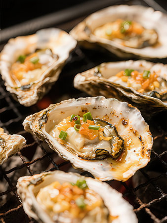 Fresh oysters on grill, closeup. Seafood background.の写真素材