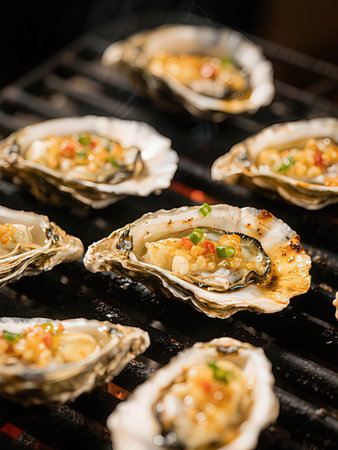 Oysters in shell on the grill. Shallow dof.