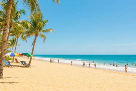 Coconut palm trees on the sandy beach and turquoise oceanの写真素材