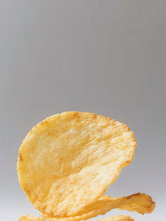 Potato chips isolated on white background. Selective focus, shallow depth of field.