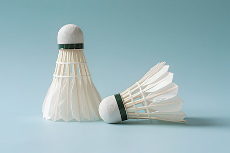 Badminton shuttlecock isolated on blue background. Sport equipment.の写真素材