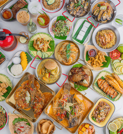 Top view of various Asian dishes on the table in a restaurant.
