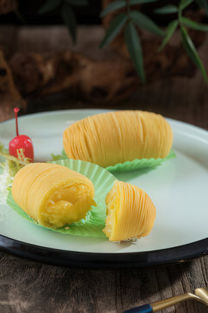 Coconut milk roll cake on wood background,Thai dessert