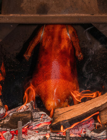 Roast duck on fire in the restaurant. Roast duck.の写真素材