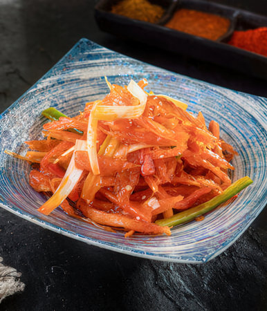 Papaya salad with papaya and ginger on a rustic backgroundの写真素材