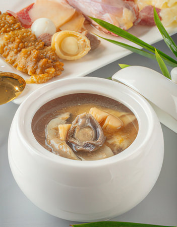 Mushroom soup in white pot on wooden table, stock photoの写真素材