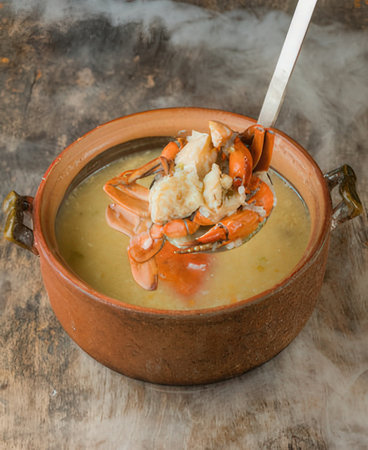 Thai spicy soup with crab in earthenware pot.の写真素材