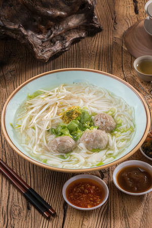 Vietnamese rice noodle soup with meatballs and pork ball