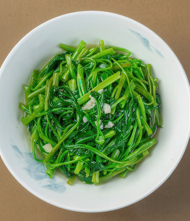 stir-fried seaweed in white bowl on brown background.の写真素材