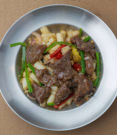 Thai style spicy stir-fried beef with onion and sweet pepper