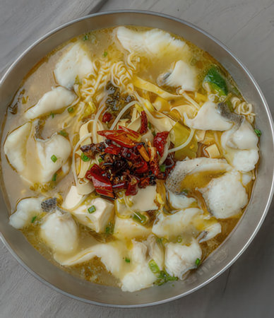 Noodles with fish in a bowl on the table, top viewの写真素材