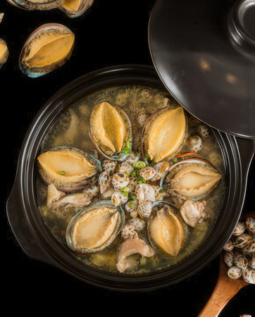 Fresh mussels in a saucepan on a black background, top viewの写真素材