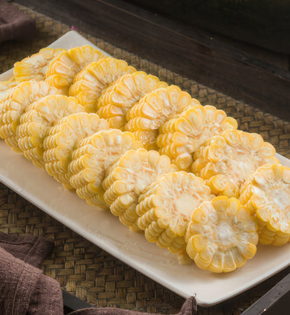 Grilled corn on the cob on a white plate, Thailand.の写真素材