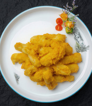 Crispy fried chicken nuggets on white plate with copy spaceの写真素材