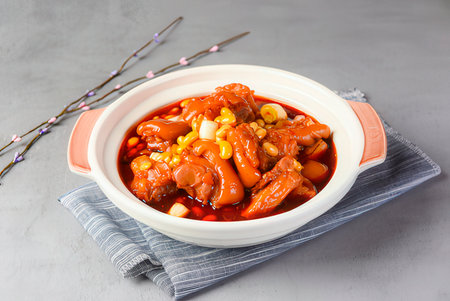 chinese red curry chicken with sweet and sour sauce on white backgroundの写真素材