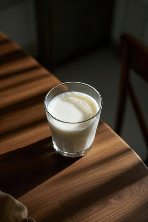 A glass of milk on a wooden table. Selective focus.の写真素材