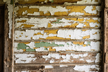 Old wooden wall with peeling paint. Grunge background.の素材