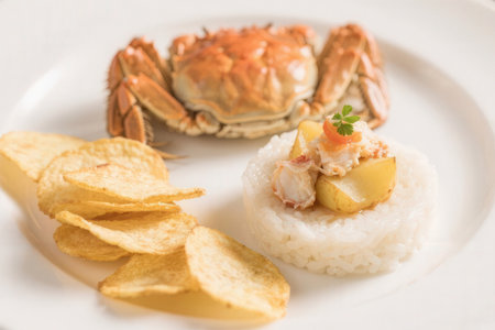 steamed crab with rice and potato chips on white plate - Japanese food styleの素材