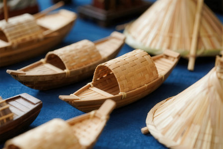 Wooden boats made of bamboo on a blue background. Close-upの素材
