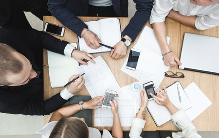 Group of business meeting at the table in the modern office ,Team work and diverse hands together joining business relationships with greetings and joint business partnership.の写真素材