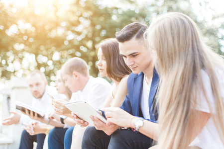 meeting of young people, team of businessmen in nature. Lifestyle, young entrepreneursの写真素材